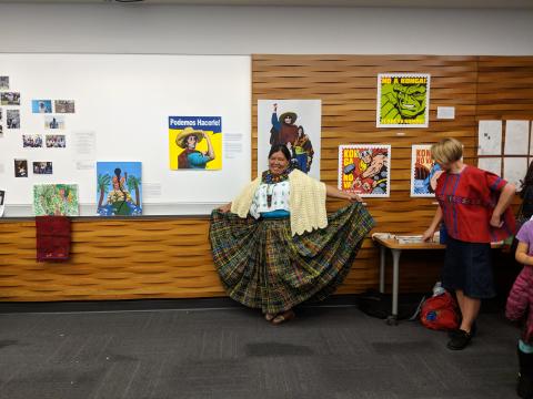 Angelica Choc poses in front of the art installation at the 2018 SMJ conference