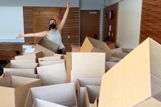 Person standing in a pile of boxes